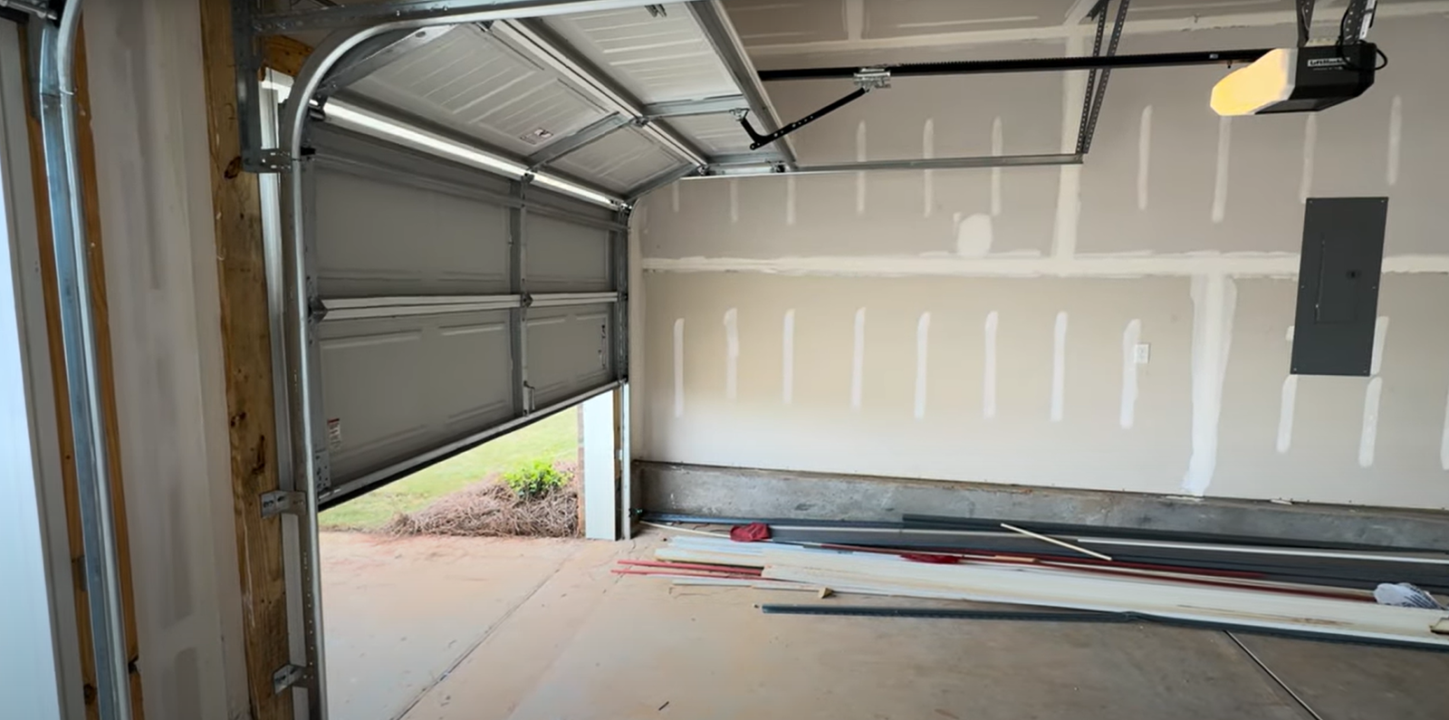 Overhead garage door being inspected and repaired by a professional technician. Optimize functionality with expert care from Local Garage Door Repair Services Sarasota.