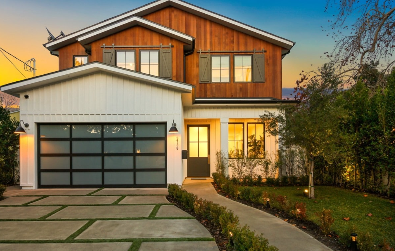 Elegant custom garage door with stained wood finish for improved curb appeal in Sarasota