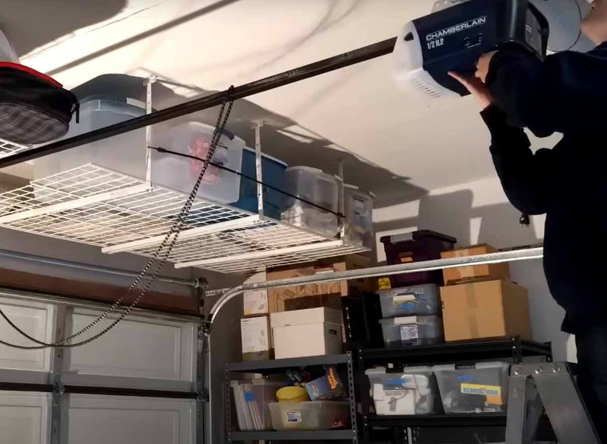Technician performing professional garage opener door repair at a residential property in Sarasota, FL, showcasing Local Garage Door Services