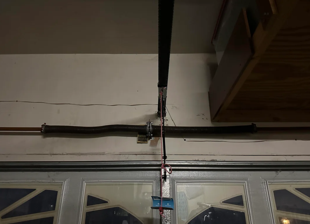 Garage door spring repair service.